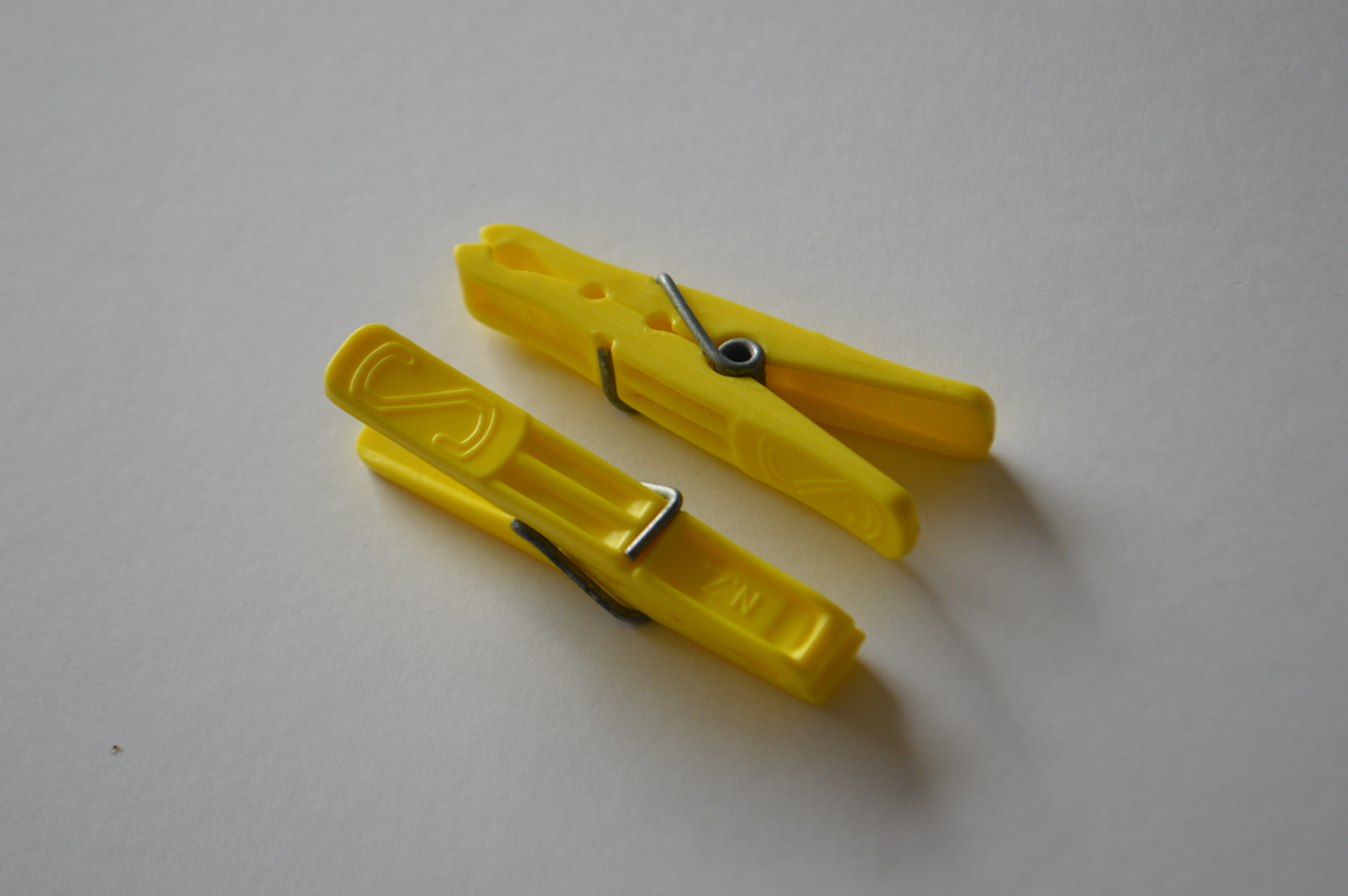 Image of a yellow plastic peg